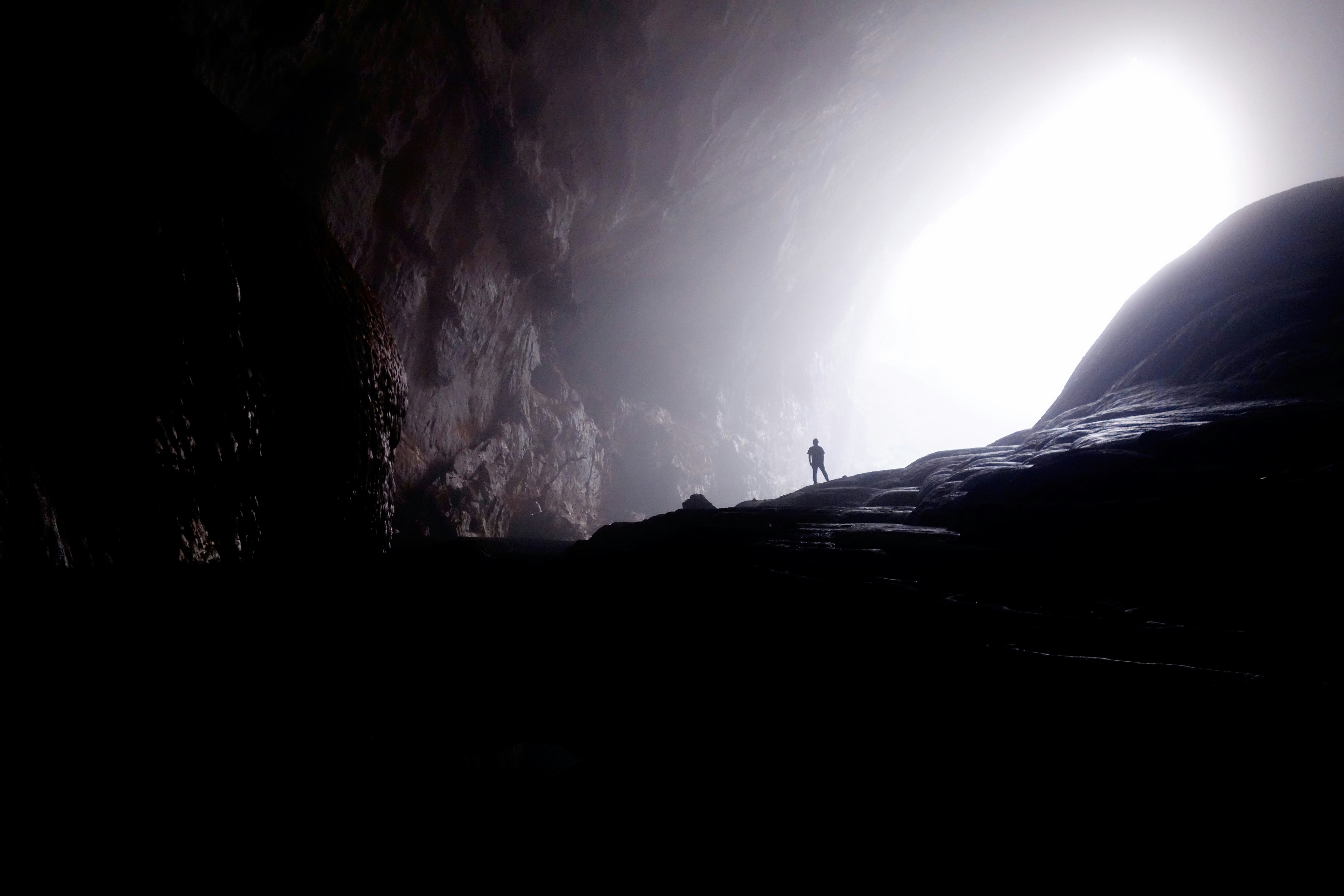 person inside of cave